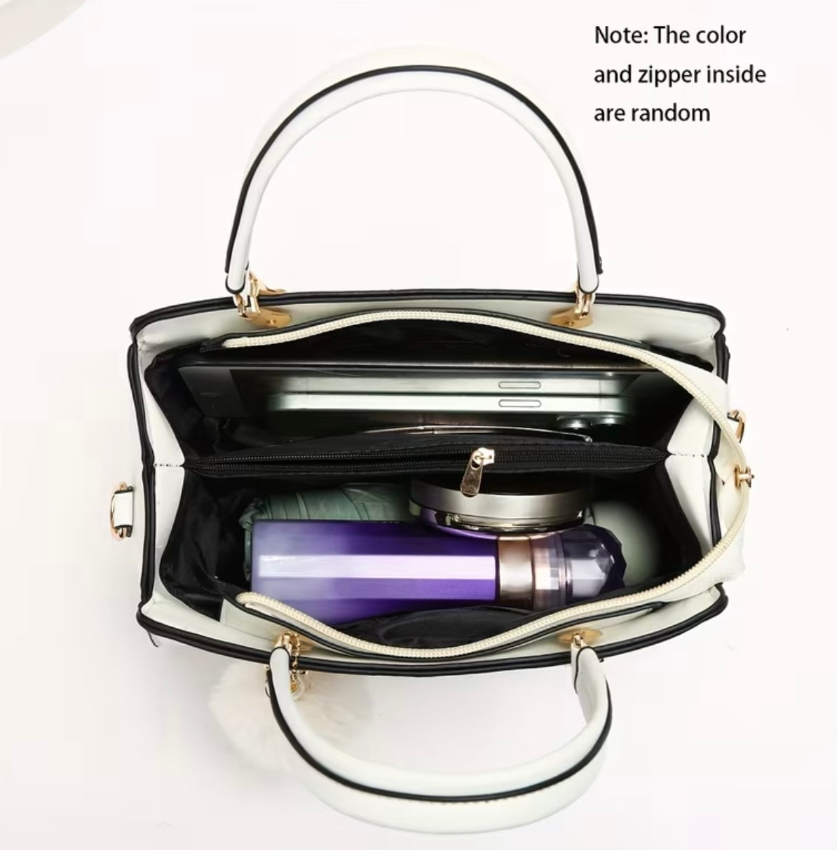 Fashionable handbag with decorative pompom