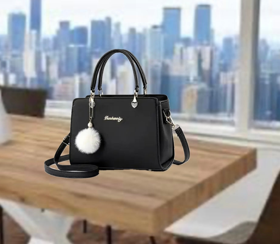 Bolso de moda con pompón decorativo