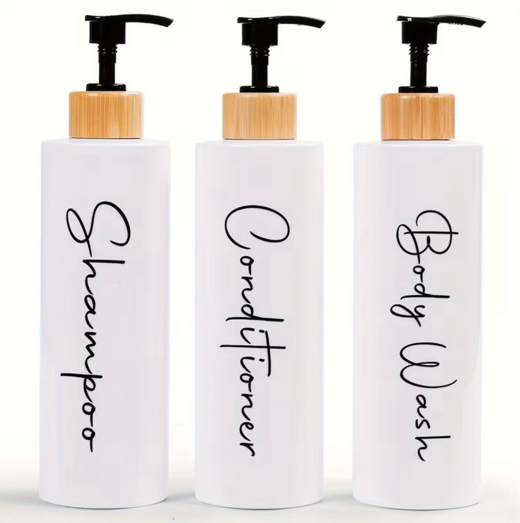 3 dispensers for shampoo, conditioner and black and white soap