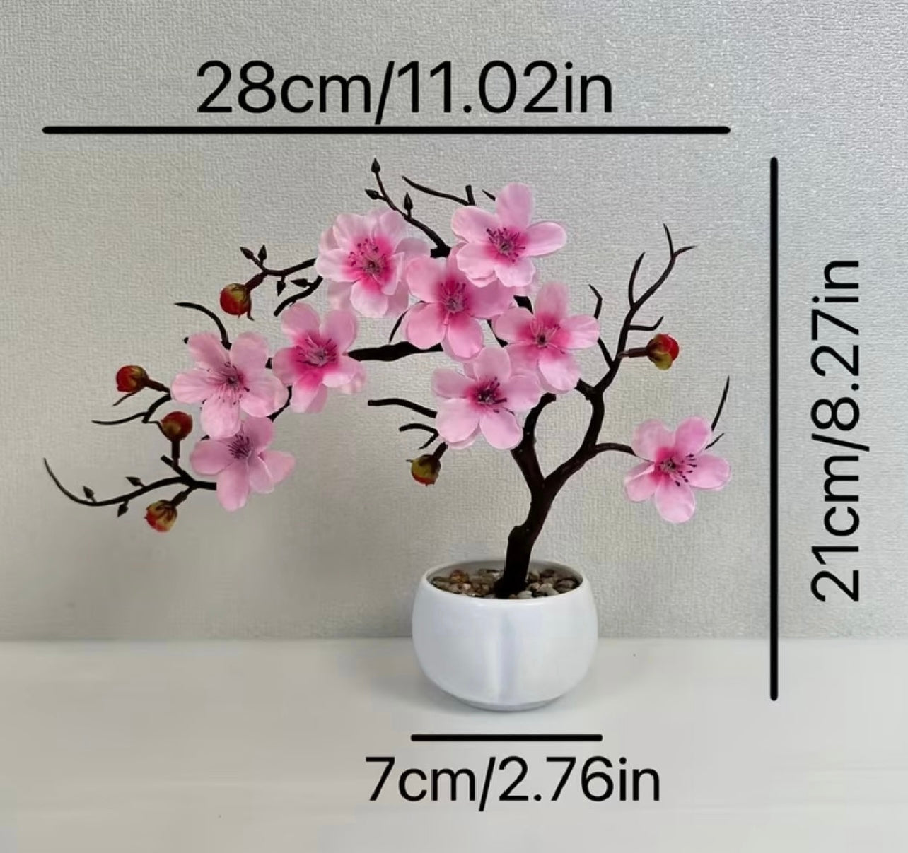 A set of potted plants with artificial plum blossoms