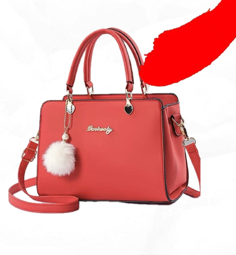 Bolso de moda con pompón decorativo