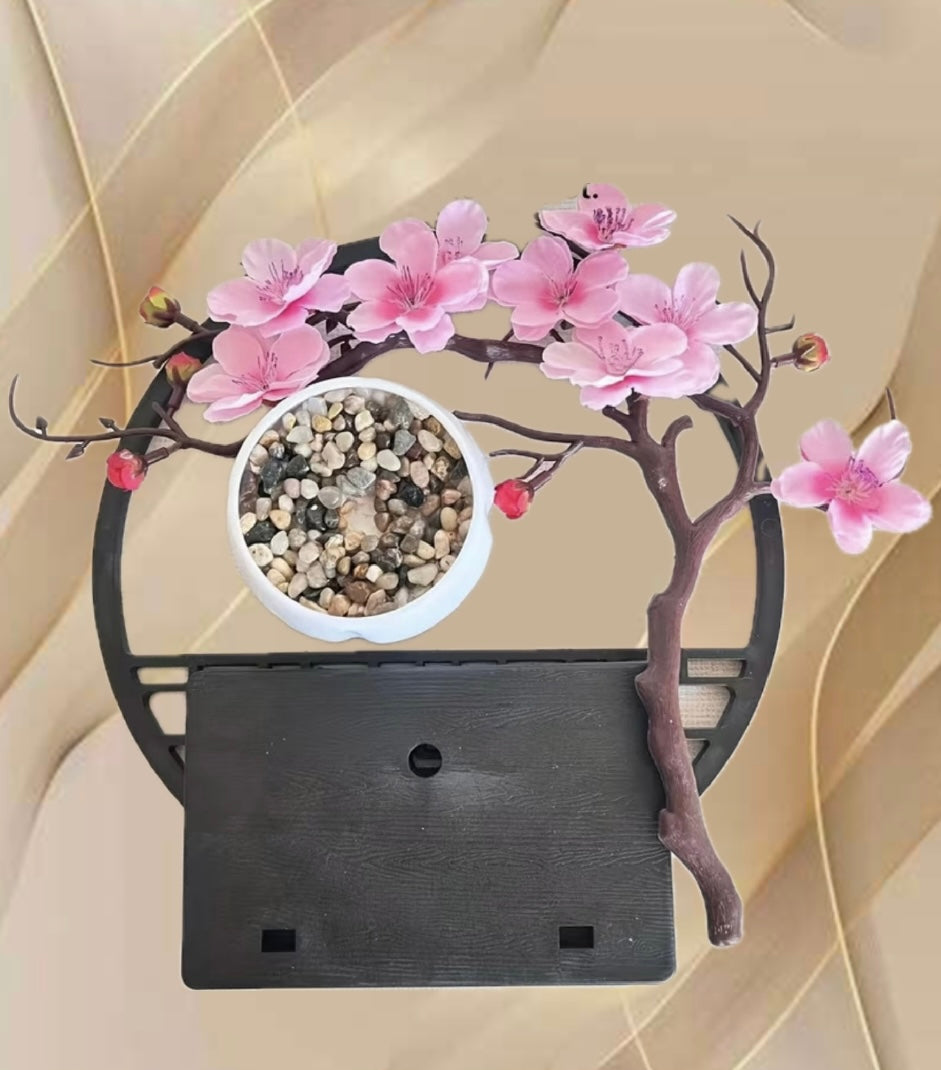 A set of potted plants with artificial plum blossoms