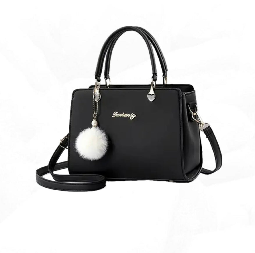 Bolso de moda con pompón decorativo