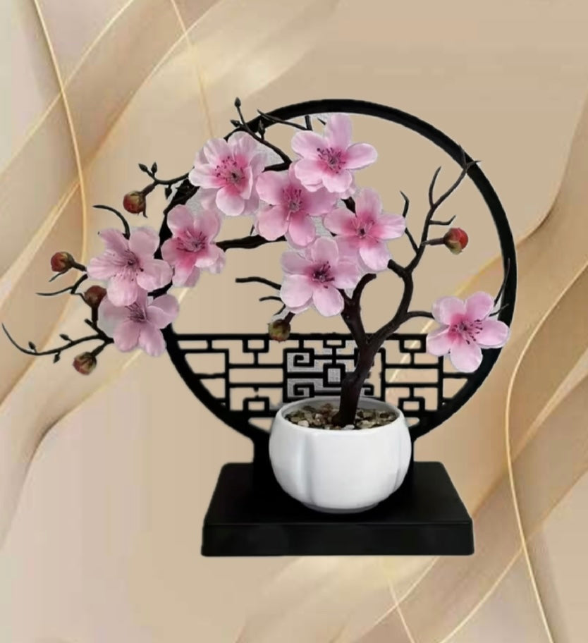A set of potted plants with artificial plum blossoms